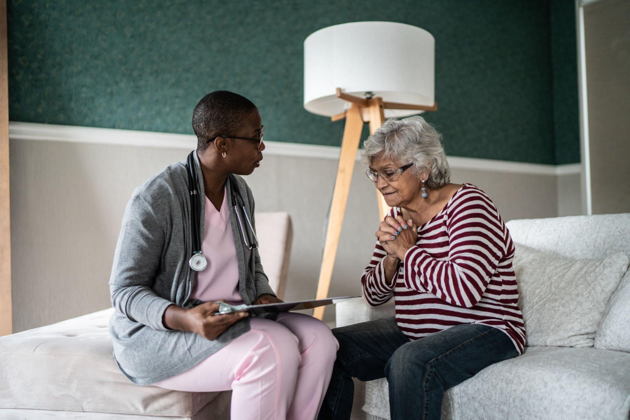 an old white lady consulting with a physician